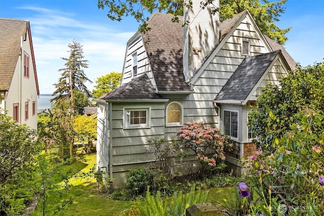 243 N Garden St, Bellingham, WA 98225 - view of side of property with roof with shingles and a chimney