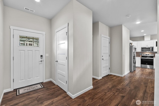 3808 181st St E, Tacoma, WA 98446 - entryway with dark wood finished floors, baseboards, and recessed lighting