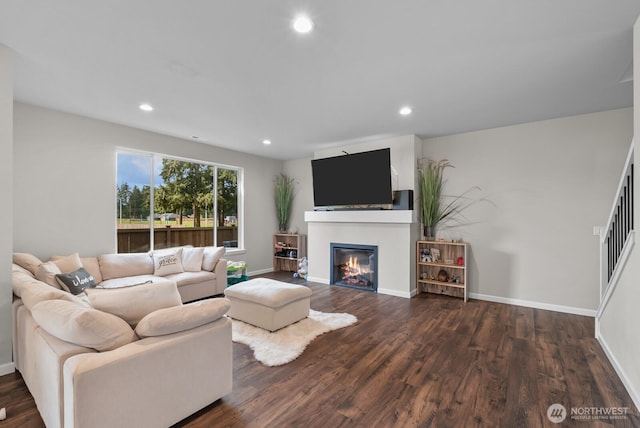 3808 181st St E, Tacoma, WA 98446 - living area with a glass covered fireplace, wood finished floors, baseboards, and recessed lighting