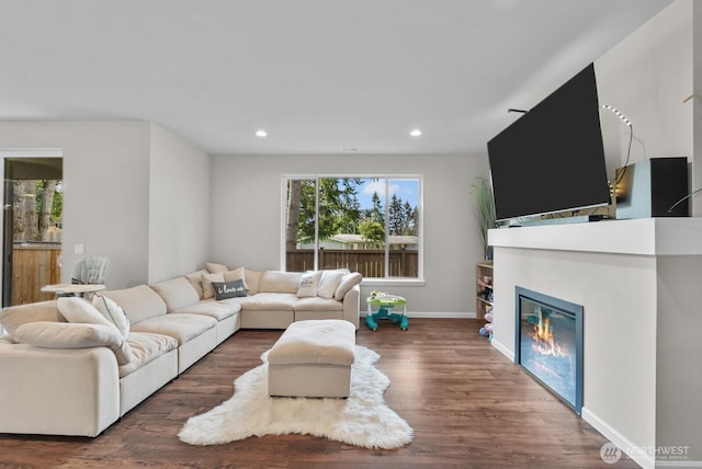 3808 181st St E, Tacoma, WA 98446 - living room featuring recessed lighting, wood finished floors, baseboards, and a glass covered fireplace