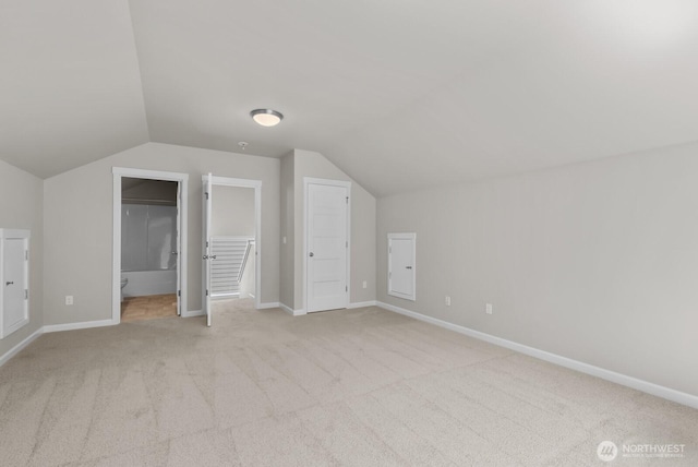 3808 181st St E, Tacoma, WA 98446 - additional living space featuring light colored carpet, lofted ceiling, and baseboards
