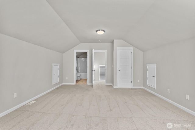 3808 181st St E, Tacoma, WA 98446 - additional living space with lofted ceiling, carpet, and baseboards