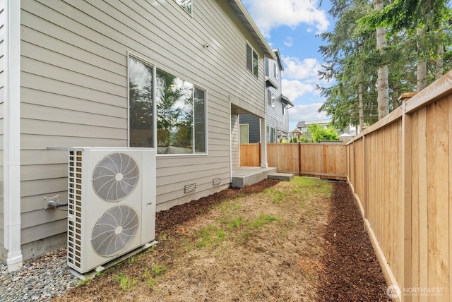 3808 181st St E, Tacoma, WA 98446 - view of side of home with a fenced backyard, ac unit, and crawl space