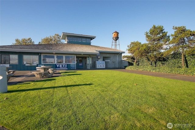 9540 Semiahmoo Pkwy Unit E14, Blaine, WA 98230 - rear view of property featuring a lawn and board and batten siding