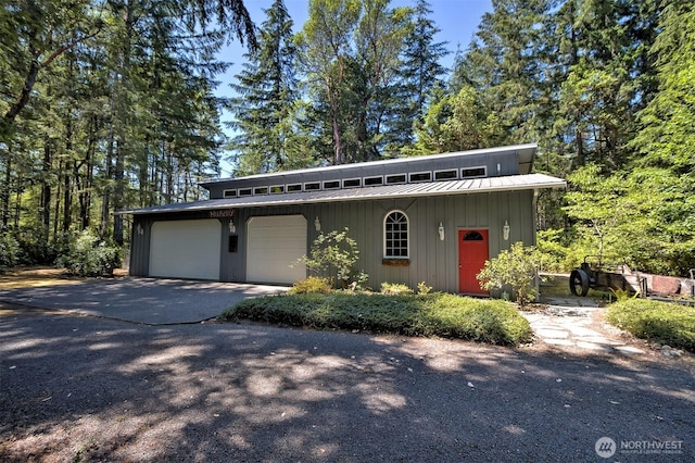 80 E Tamarack Ln, Shelton, WA 98584 - mid-century home with an attached garage, an outdoor structure, driveway, metal roof, and a standing seam roof
