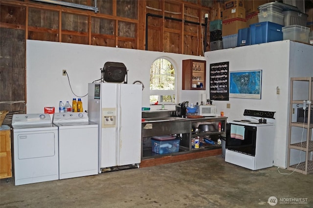80 E Tamarack Ln, Shelton, WA 98584 - garage featuring washer and clothes dryer and white refrigerator with ice dispenser