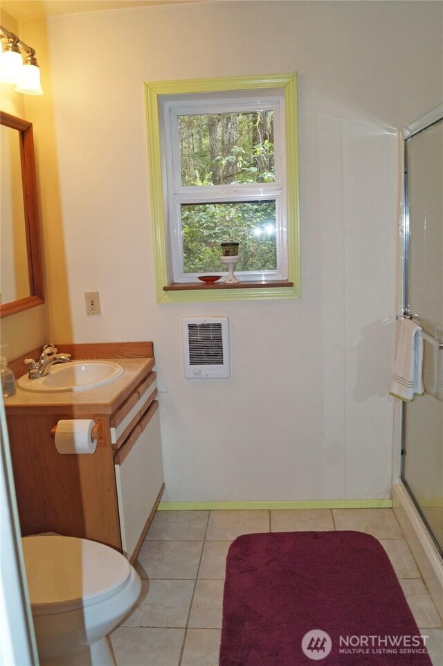 80 E Tamarack Ln, Shelton, WA 98584 - full bathroom featuring vanity, a stall shower, heating unit, baseboards, and tile patterned floors