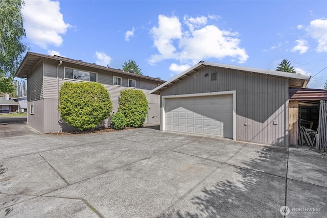 6015 NW Perthshire Rd, Vancouver, WA 98663 - view of front of house with an outbuilding and a garage