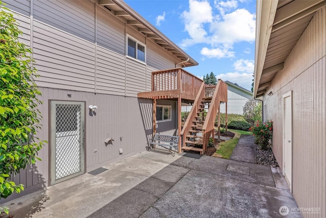6015 NW Perthshire Rd, Vancouver, WA 98663 - back of house featuring stairs, a patio, and a wooden deck