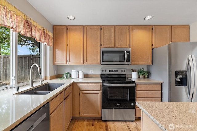 30515 127th Pl SE, Auburn, WA 98092 - kitchen featuring appliances with stainless steel finishes, a sink, light countertops, recessed lighting, and light wood-style flooring