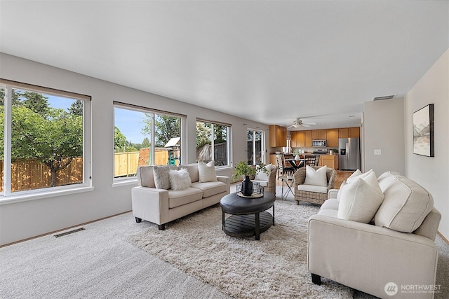 30515 127th Pl SE, Auburn, WA 98092 - living room with light colored carpet, baseboards, and ceiling fan
