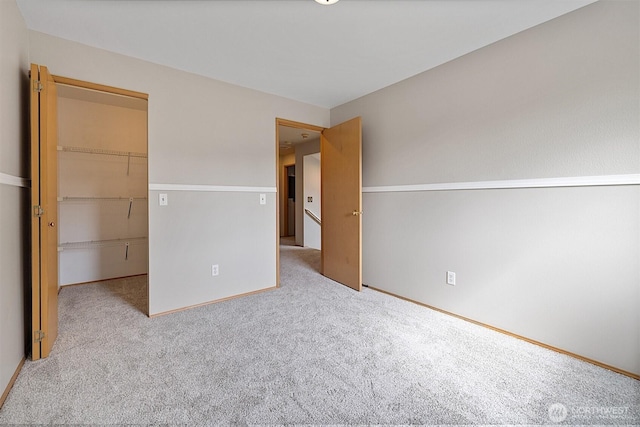 30515 127th Pl SE, Auburn, WA 98092 - unfurnished bedroom with a closet, carpet flooring, a spacious closet, and baseboards