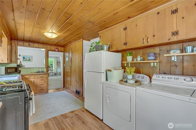 9024 29th St W, University Place, WA 98466 - laundry area with washer and clothes dryer, light wood-style flooring, wood walls, and wood ceiling
