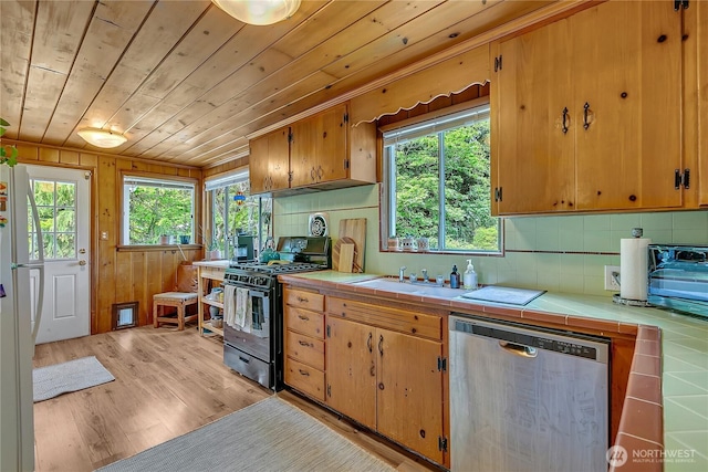 9024 29th St W, University Place, WA 98466 - kitchen featuring stainless steel dishwasher, black gas range, tile countertops, wood ceiling, and tasteful backsplash