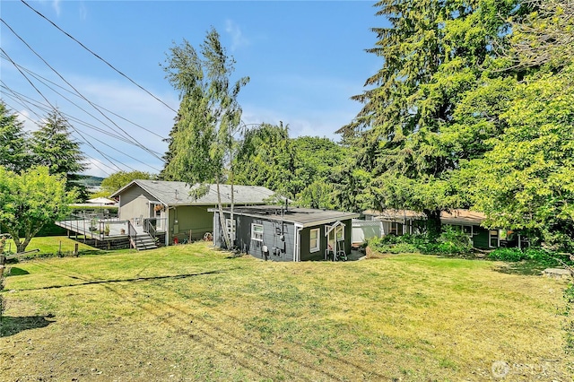 9024 29th St W, University Place, WA 98466 - view of grassy yard featuring a wooden deck