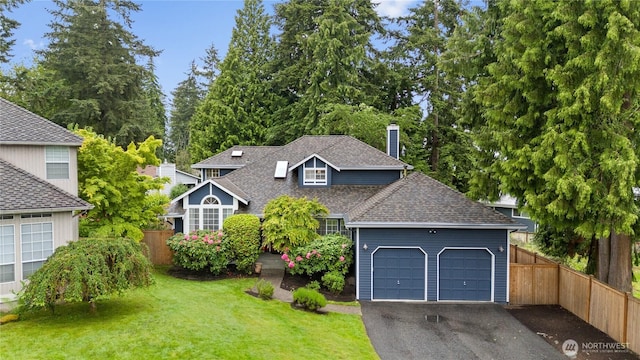 8221 122nd Ave NE, Kirkland, WA 98033 - view of front of house featuring a garage, asphalt driveway, a shingled roof, and a chimney