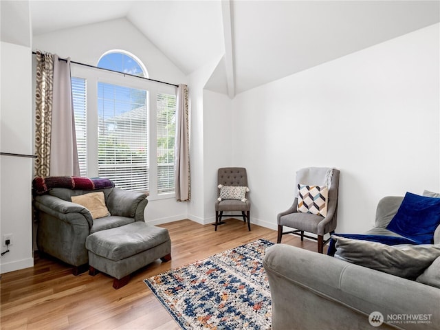 8221 122nd Ave NE, Kirkland, WA 98033 - living area featuring lofted ceiling, light wood-style floors, and baseboards