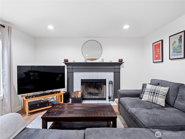 8221 122nd Ave NE, Kirkland, WA 98033 - living area with wood finished floors, a tile fireplace, and recessed lighting