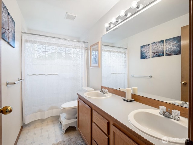 8221 122nd Ave NE, Kirkland, WA 98033 - bathroom featuring tile patterned floors, toilet, double vanity, and a shower with curtain