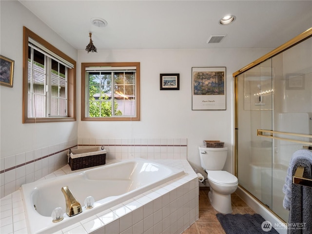 8221 122nd Ave NE, Kirkland, WA 98033 - full bathroom with toilet, a garden tub, a stall shower, and tile patterned floors