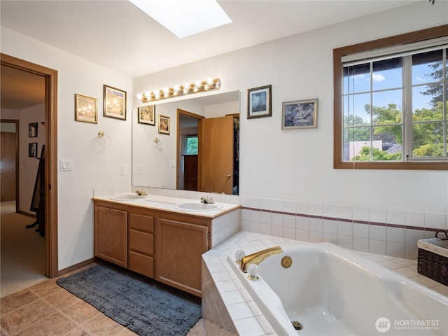 8221 122nd Ave NE, Kirkland, WA 98033 - bathroom featuring a skylight, double vanity, and a bath