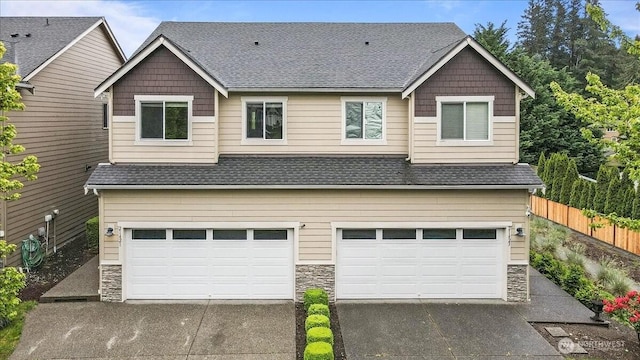 21421 104th Street Ct E, Bonney Lake, WA 98391 - craftsman house featuring stone siding, a garage, driveway, and a shingled roof
