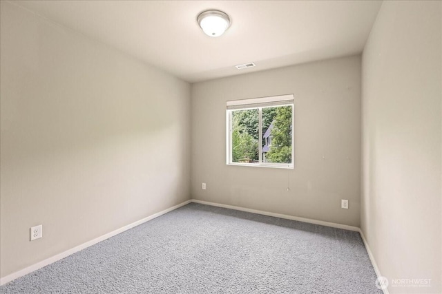 21421 104th Street Ct E, Bonney Lake, WA 98391 - spare room featuring carpet floors and baseboards