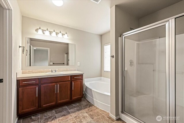 21421 104th Street Ct E, Bonney Lake, WA 98391 - bathroom featuring vanity, a shower stall, and a garden tub