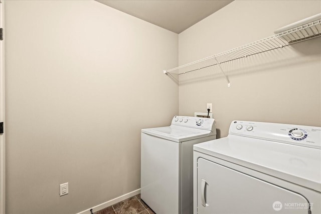 21421 104th Street Ct E, Bonney Lake, WA 98391 - laundry area with washer and dryer, baseboards, and dark tile patterned floors