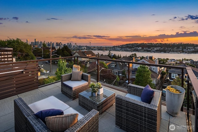 2222 Broadway E, Seattle, WA 98102 - patio terrace at dusk with an outdoor living space and a balcony