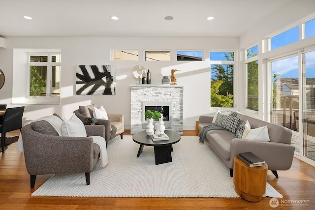 2222 Broadway E, Seattle, WA 98102 - living room featuring wood finished floors, recessed lighting, and a fireplace