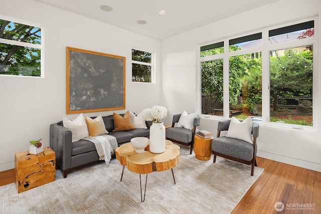 2222 Broadway E, Seattle, WA 98102 - living area with wood finished floors, baseboards, and recessed lighting