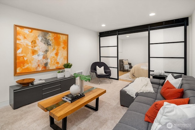 2222 Broadway E, Seattle, WA 98102 - living room with a barn door, light carpet, and recessed lighting