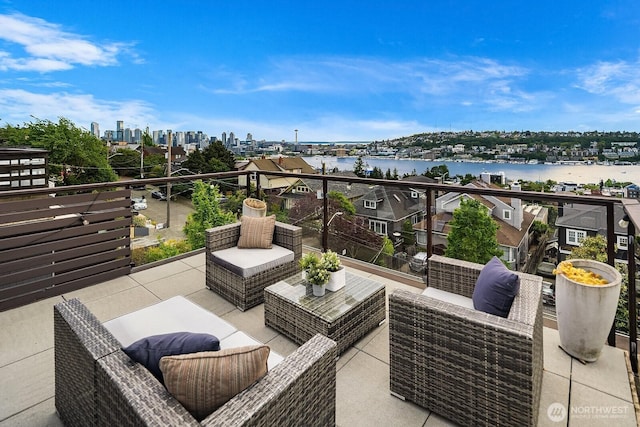 2222 Broadway E, Seattle, WA 98102 - view of patio featuring a balcony, a water view, a view of city, and an outdoor hangout area