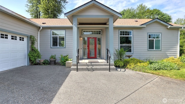 6614 241st Ave E Unit 38, Buckley, WA 98321 - view of front of home featuring roof with shingles, driveway, and a garage