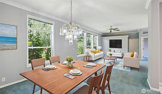 6614 241st Ave E Unit 38, Buckley, WA 98321 - carpeted dining room with crown molding, a ceiling fan, and a chandelier