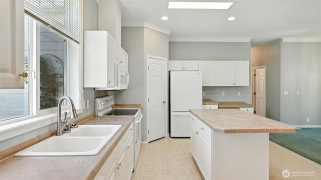 6614 241st Ave E Unit 38, Buckley, WA 98321 - kitchen featuring white appliances, a center island, ornamental molding, white cabinets, and light countertops