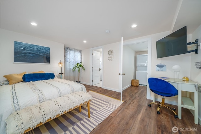 9316 7th Ave S, Seattle, WA 98108 - bedroom featuring stacked washer and clothes dryer, baseboards, wood finished floors, and recessed lighting