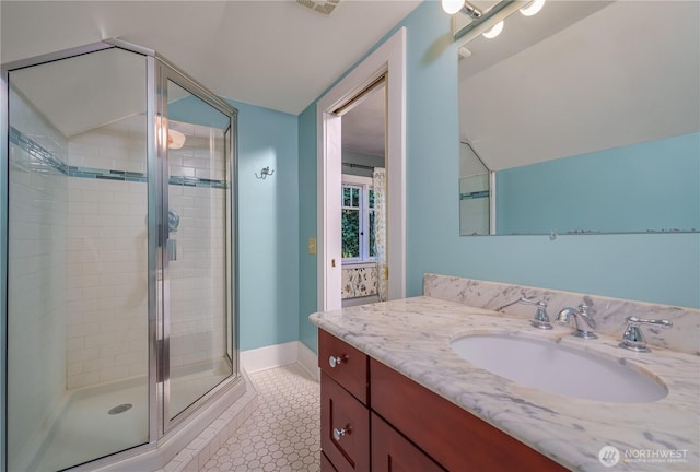 9316 7th Ave S, Seattle, WA 98108 - bathroom with lofted ceiling, vanity, a stall shower, and baseboards