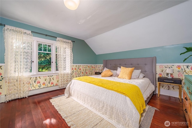 9316 7th Ave S, Seattle, WA 98108 - bedroom with wallpapered walls, hardwood / wood-style flooring, vaulted ceiling, and a baseboard radiator