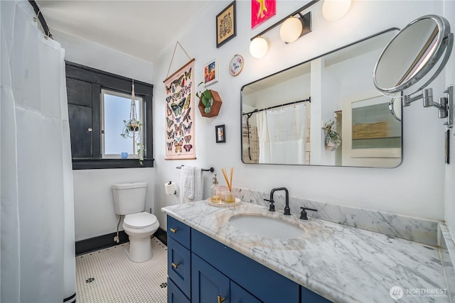 9316 7th Ave S, Seattle, WA 98108 - full bathroom with vanity, toilet, tile patterned flooring, and a shower with curtain