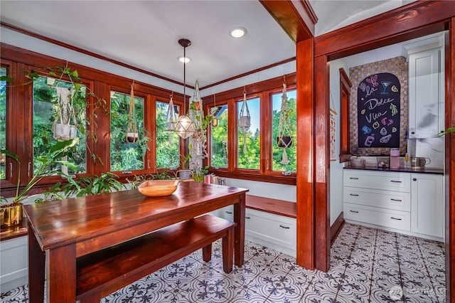 9316 7th Ave S, Seattle, WA 98108 - dining room featuring healthy amount of natural light, ornamental molding, recessed lighting, and light tile patterned floors