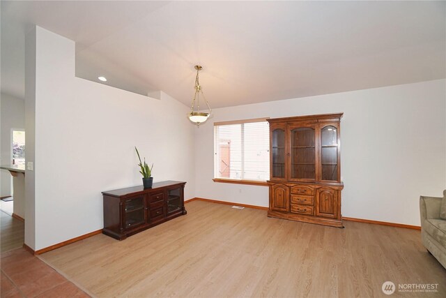 2820 V Ct SE, Auburn, WA 98002 - living area featuring baseboards, light wood-style flooring, and vaulted ceiling