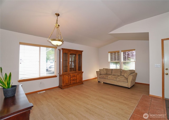 2820 V Ct SE, Auburn, WA 98002 - living area with light wood-type flooring, lofted ceiling, and baseboards