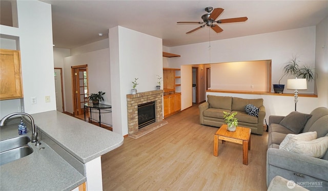 2820 V Ct SE, Auburn, WA 98002 - living area with a ceiling fan, light wood-style flooring, and a glass covered fireplace