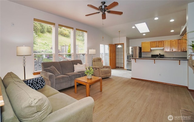 2820 V Ct SE, Auburn, WA 98002 - living room with a skylight, ceiling fan, recessed lighting, lofted ceiling, and light wood-style flooring