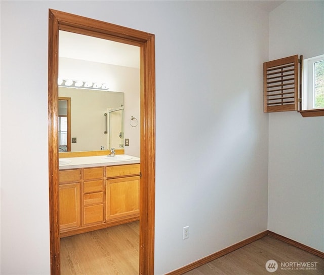 2820 V Ct SE, Auburn, WA 98002 - full bathroom with wood finished floors, double vanity, an enclosed shower, and baseboards