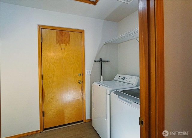 2820 V Ct SE, Auburn, WA 98002 - washroom featuring washing machine and dryer and wood finished floors