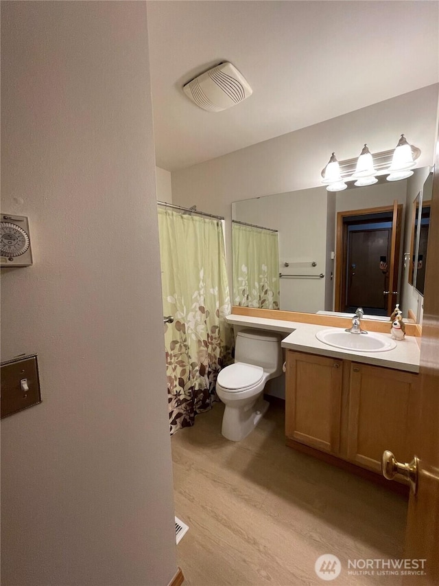 2820 V Ct SE, Auburn, WA 98002 - full bath with toilet, wood finished floors, vanity, and a shower with curtain