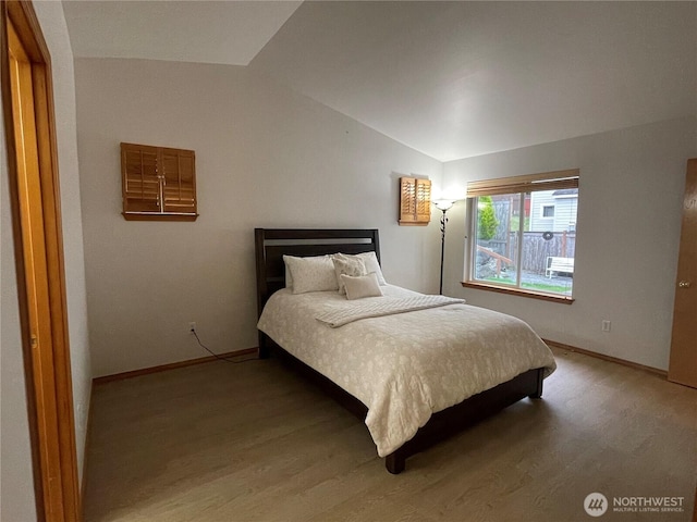 2820 V Ct SE, Auburn, WA 98002 - bedroom featuring lofted ceiling, light wood-style flooring, and baseboards